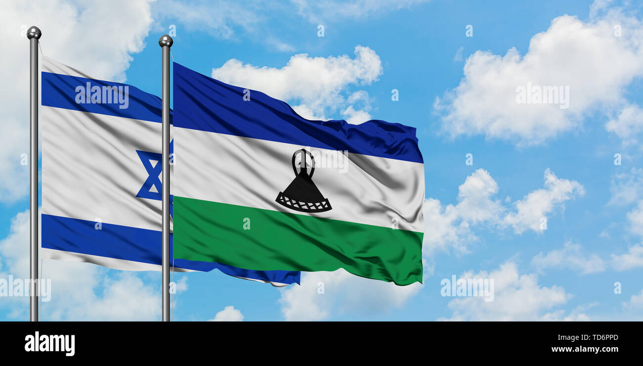 Israel and Lesotho flag waving in the wind against white cloudy blue sky together. Diplomacy concept, international relations. Stock Photo