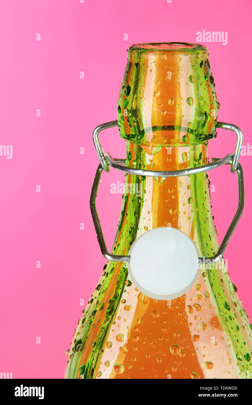 Colorful bottle on pink background Stock Photo - Alamy