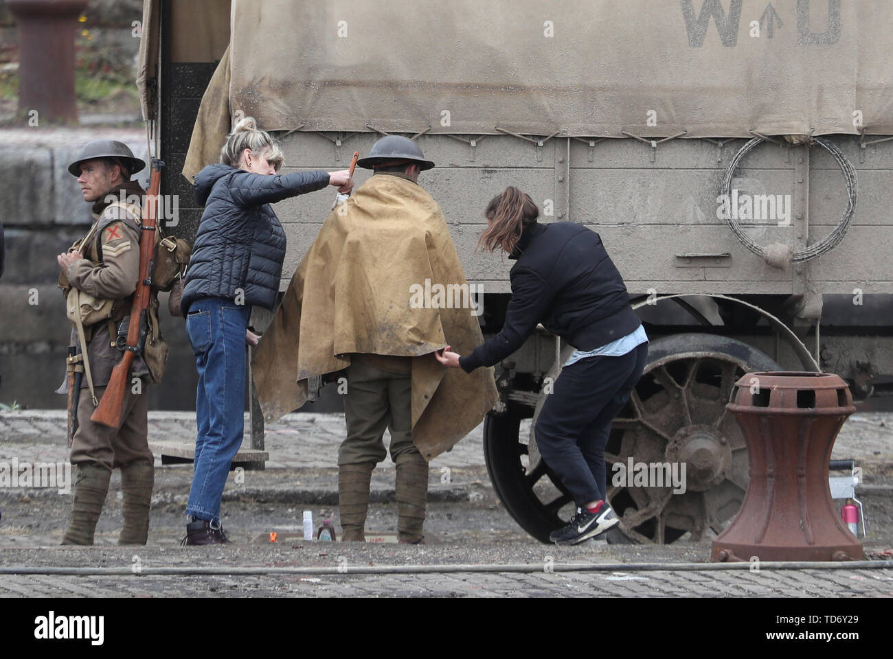 Actors have the costumes adjusted on set of Sam Mendes new film 1917 during filming at Govan Docks in Glasgow.PRESS ASSOCIATION Photo. Picture date:Tuesday June 12, 2019. Photo credit should read: Andrew Milligan/PA Wire Stock Photo