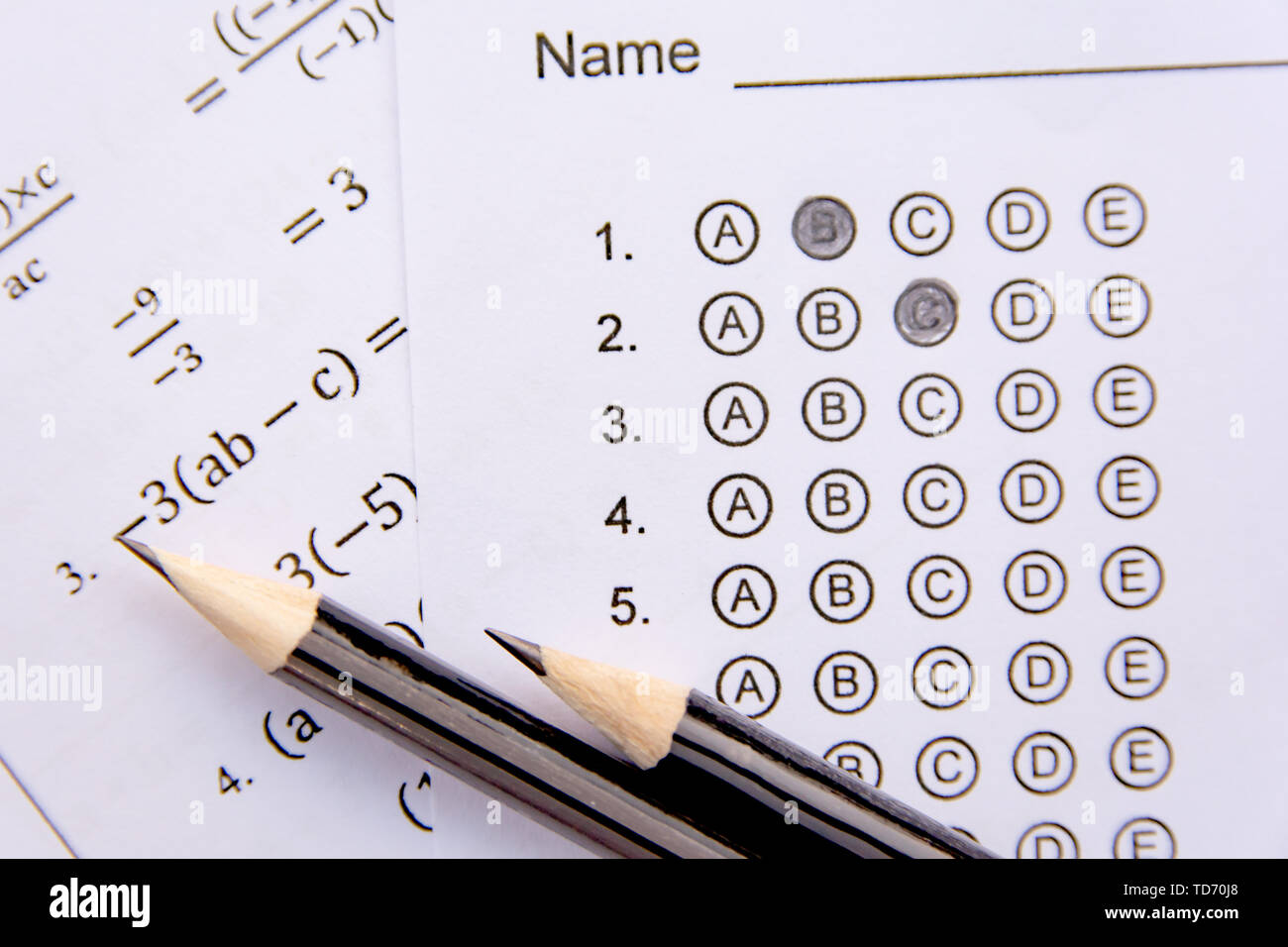 pencil-on-answer-sheets-or-standardized-test-form-with-answers-bubbled