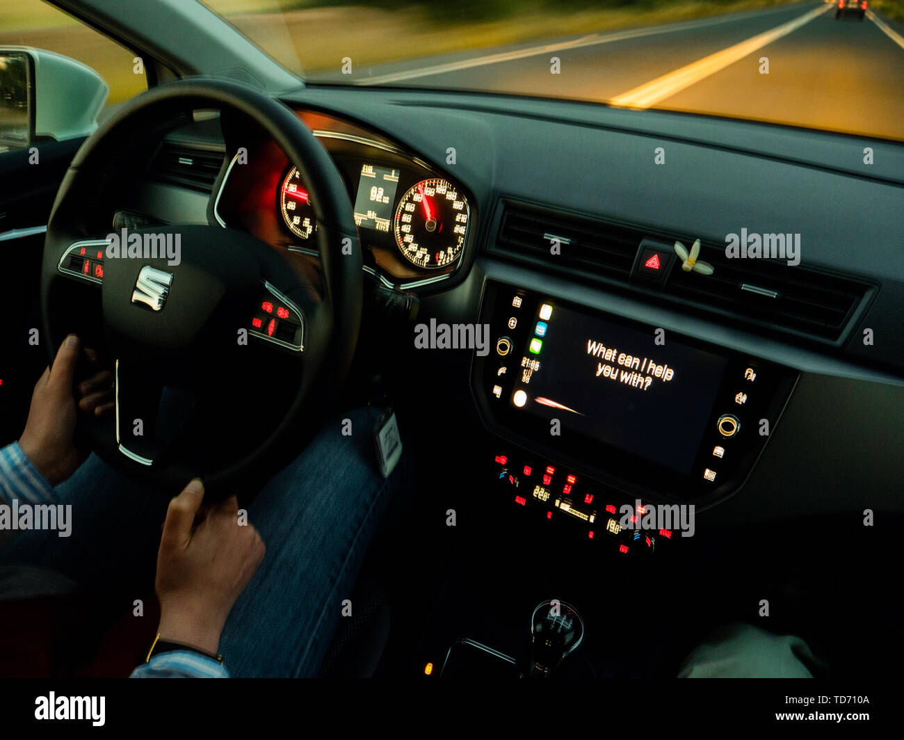 Palma de Mallorca, Spain - May 8, 2018: Defocused abstract view of Seat car using Apple Car iOS with multiple siri assistant asking What can i help yo Stock Photo