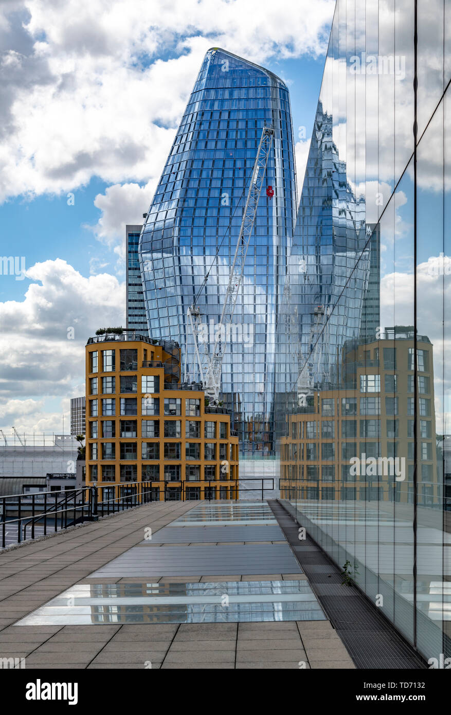 New skyscraper in London officially called One Blackfriars. Also known as The Vase or The Boomerang. The reflective building, right is Tate Modern. Stock Photo