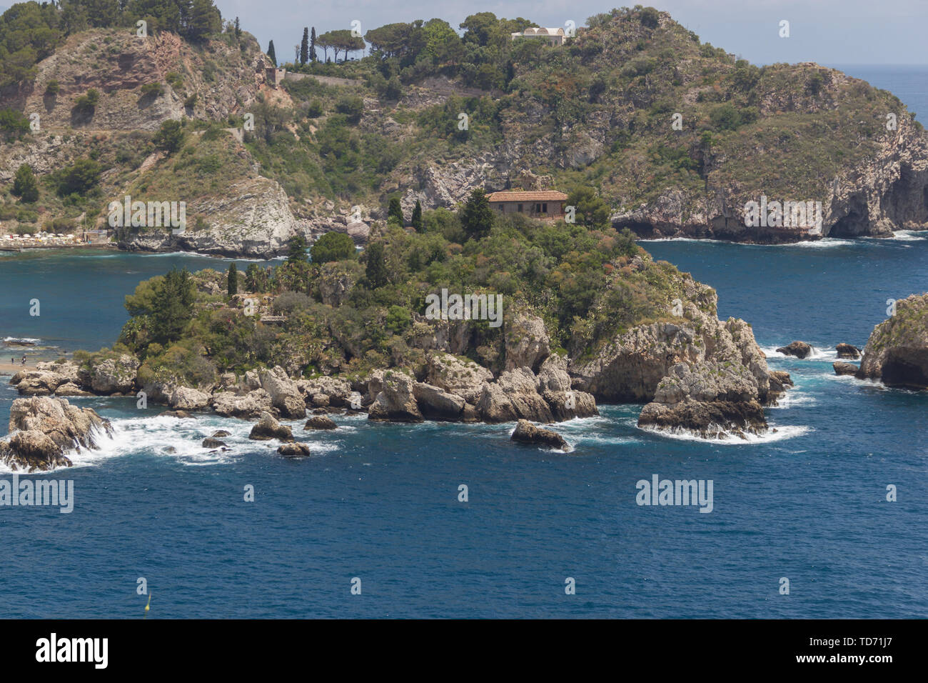 Taormina Sicily beautiful beach side at the Isola Bella, vacation place with nature and blue sea Stock Photo