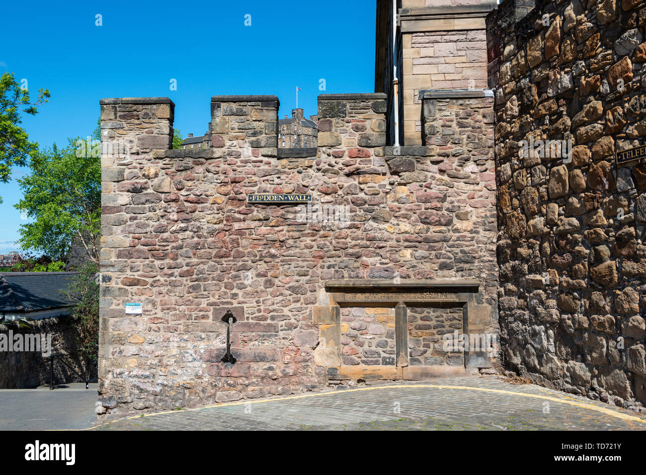 Remains of 16th century Flodden Wall, with Telfer Wall (17th century) on right, on the Vennel in Edinburgh Old Town, Scotland, UK Stock Photo