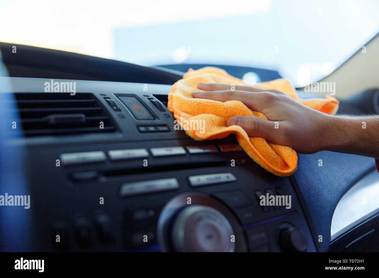 Image Of Male S Hand With Orange Rag Washing Car Interior