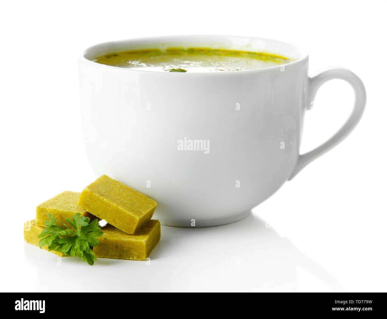 Cup of soup with bouillon cubes, isolated on white Stock Photo Alamy