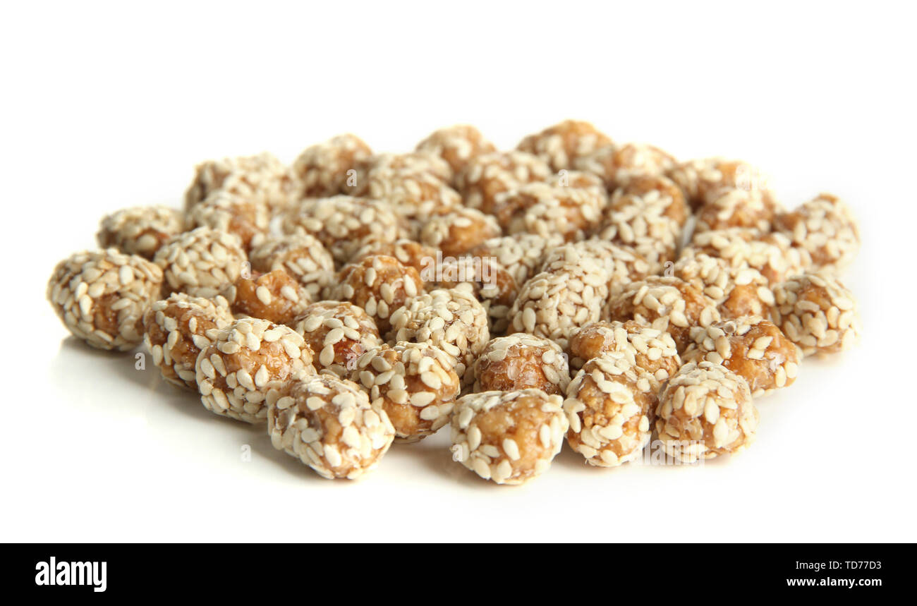 Tasty peanuts with sesame and caramel, isolated on white Stock Photo