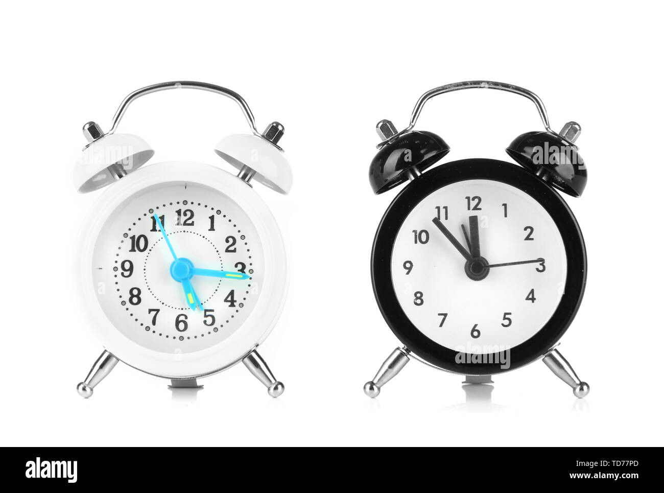 Two old style alarm clocks isolated on white Stock Photo - Alamy