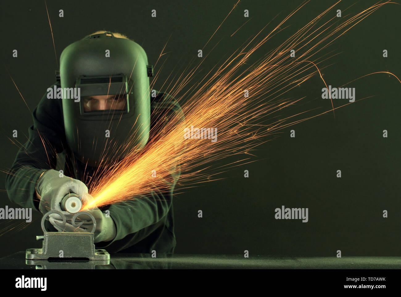 Portrait of workman in black mask, isolated on black Stock Photo - Alamy