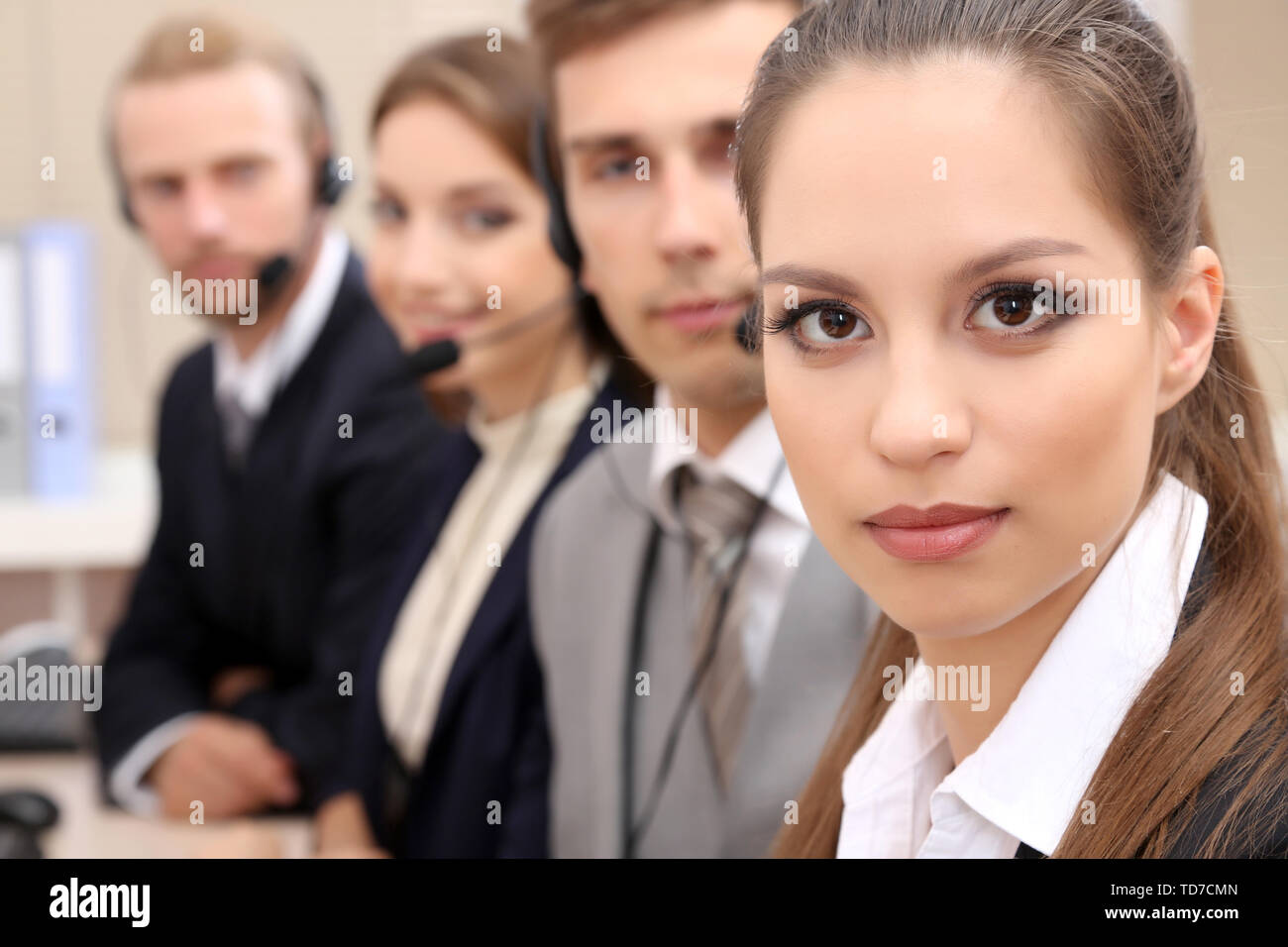 Call center operators at work Stock Photo