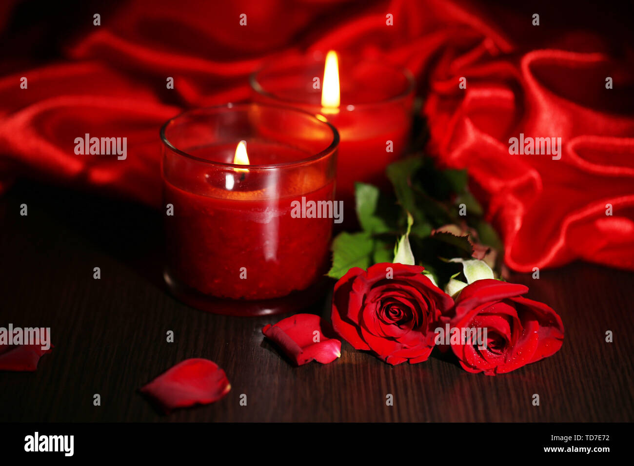 Beautiful romantic red candle with flowers and silk cloth, close up Stock  Photo - Alamy
