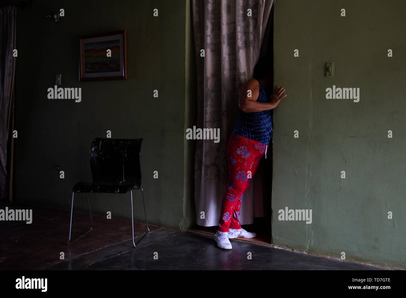 Caracas, Venezuela. 4th June, 2019. A woman looks at a family member in another room in her home in Petare Venezuela. Petare is the biggest slum in Caracas Venezuela, and the third largest in Latiin America. Credit: Allison Dinner/ZUMA Wire/Alamy Live News Stock Photo