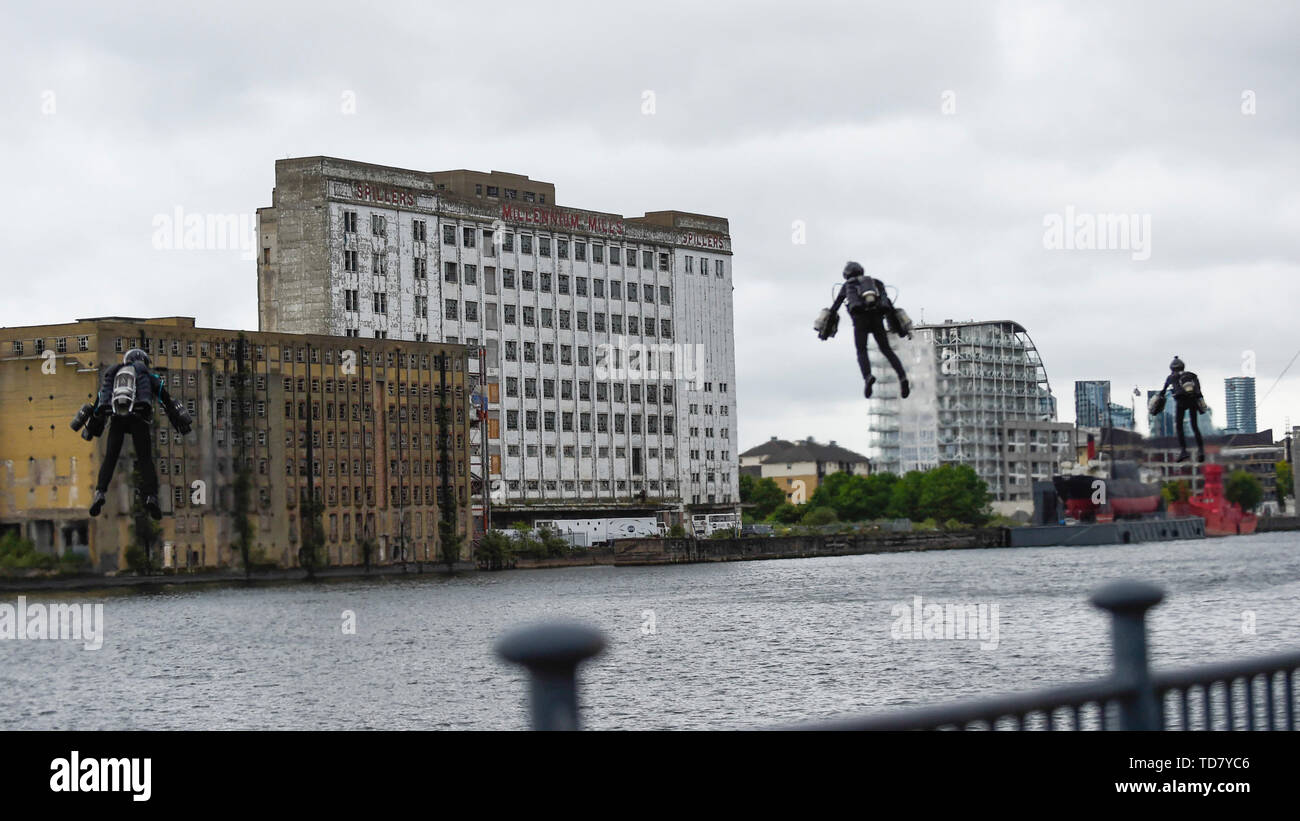 London, UK.  13 June 2019.  Richard Browning the Founder and Chief Test Pilot of Gravity Industries and ‘real life Iron Man’ takes off with two other pilots from Gravity Industries to preview their Race Series concept at Royal Victoria Docks, East London, during London Tech Week 2019, ahead of the launch of Gravity Industries’ International Race Series in early 2020.  Gravity Industries are the designers, builders and pilots of the world’s first patented Jet Suit, pioneering a new era of human flight. Credit: Stephen Chung / Alamy Live News Stock Photo