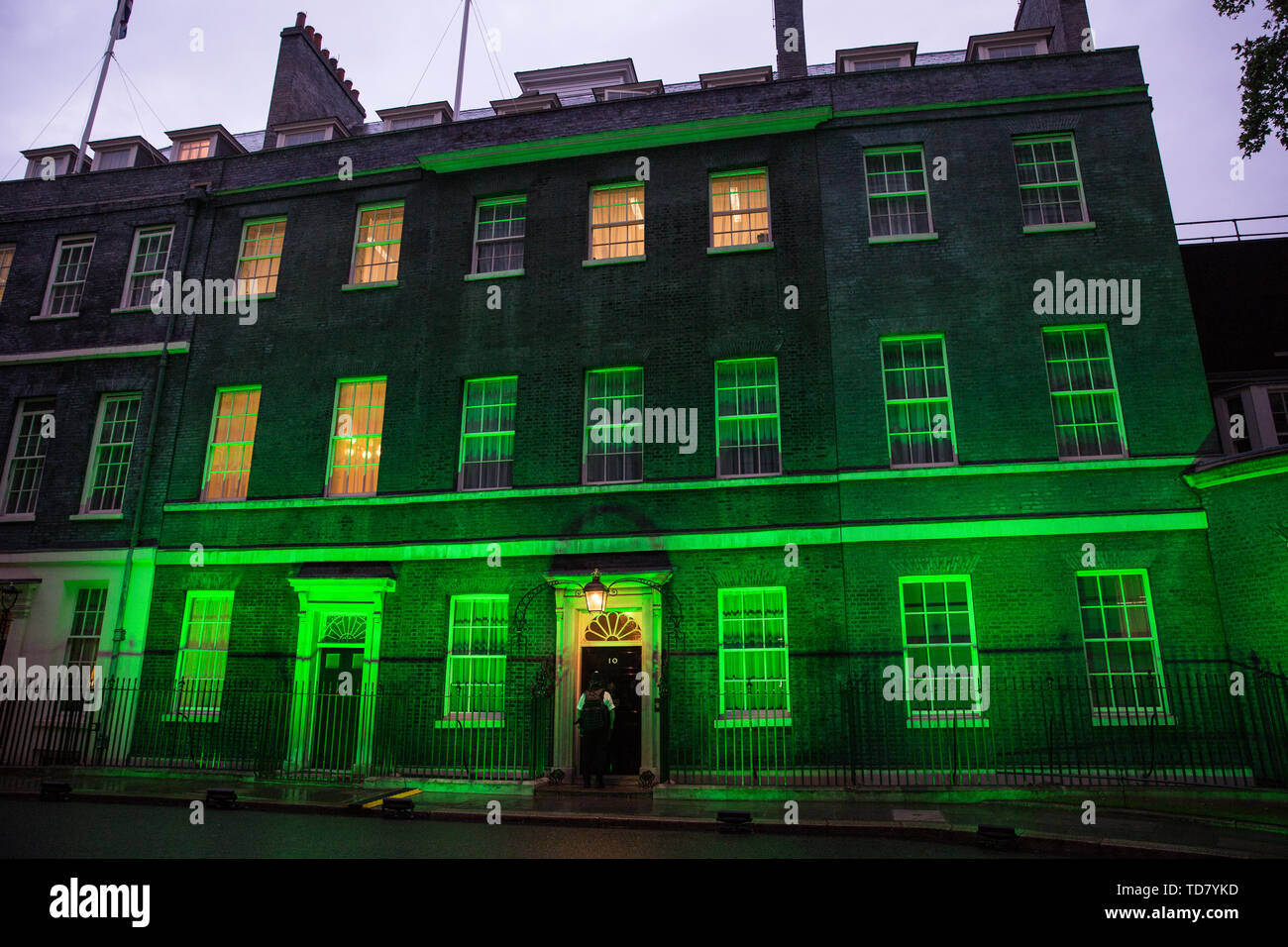 London, UK. 13 June, 2019. 10 Downing Street is lit in green to mark the second anniversary of the Grenfell Tower fire on 14th June 2017 in which 72 people died and over 70 were injured. Credit: Mark Kerrison/Alamy Live News Stock Photo