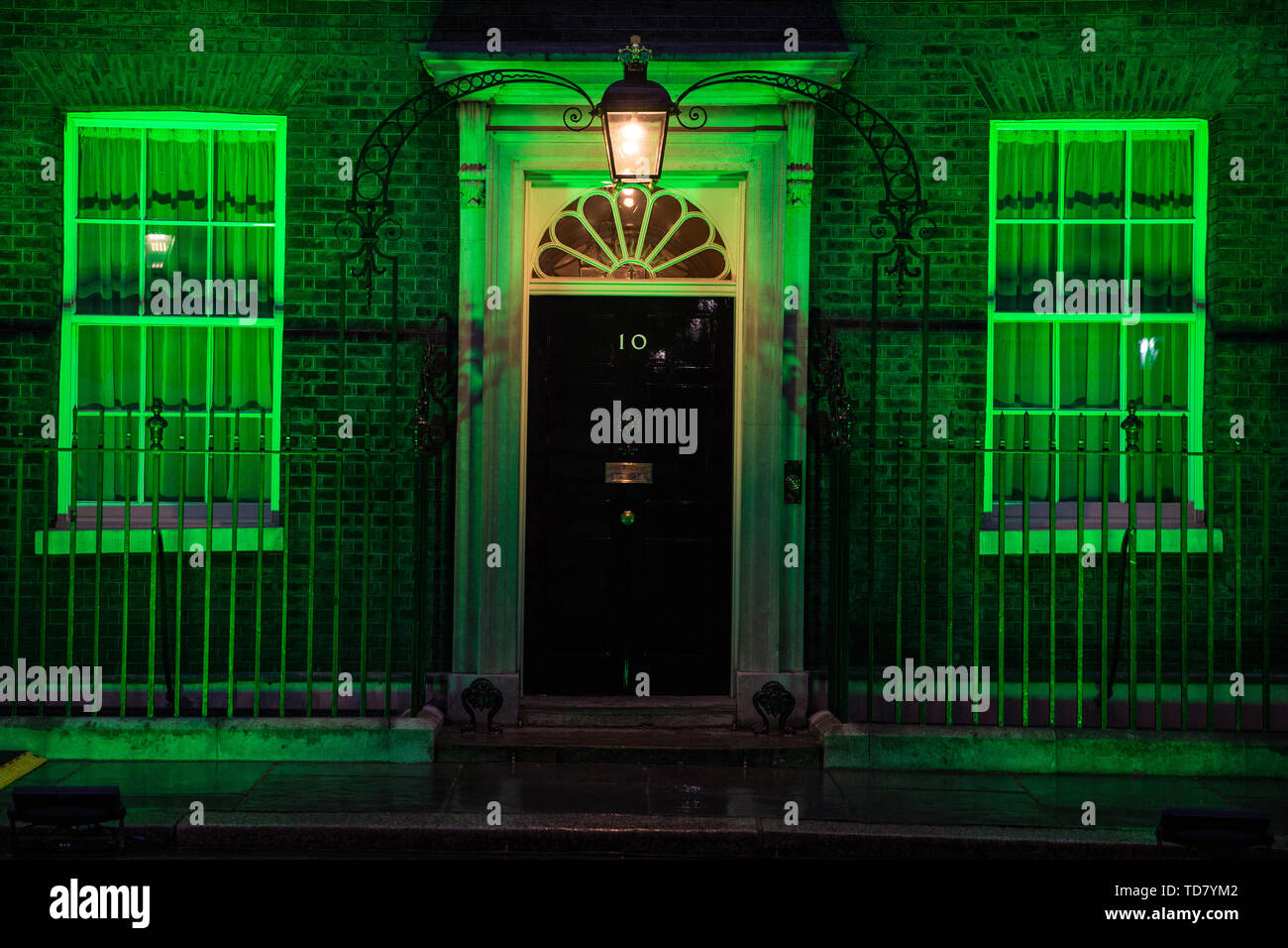 London, UK. 13 June, 2019. 10 Downing Street is lit in green to mark the second anniversary of the Grenfell Tower fire on 14th June 2017 in which 72 people died and over 70 were injured. Credit: Mark Kerrison/Alamy Live News Stock Photo