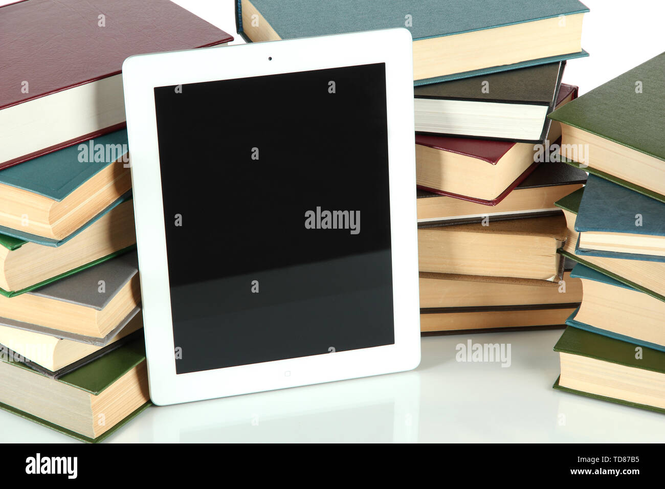 Tablet and books isolated on white Stock Photo