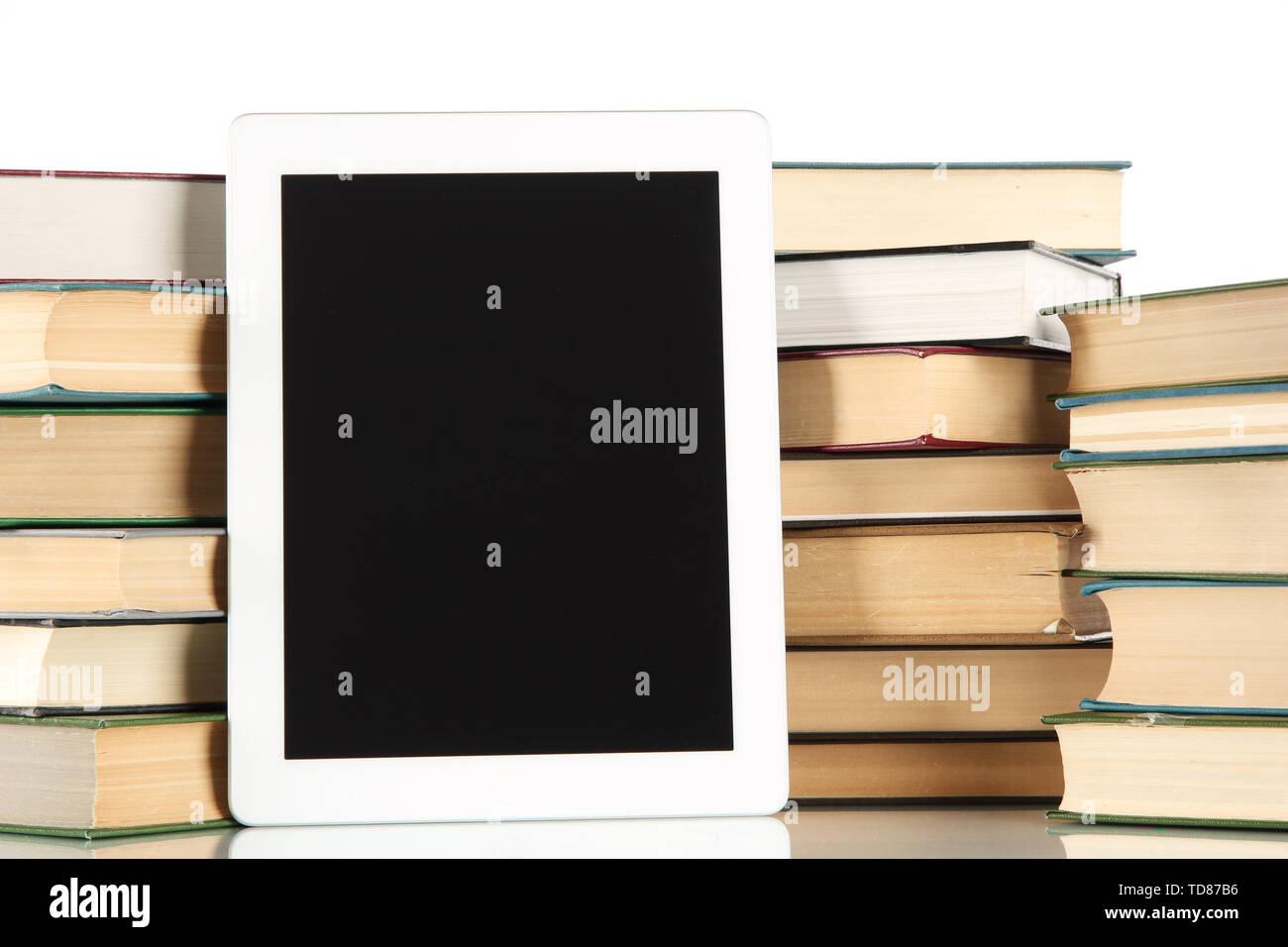 Tablet and books isolated on white Stock Photo