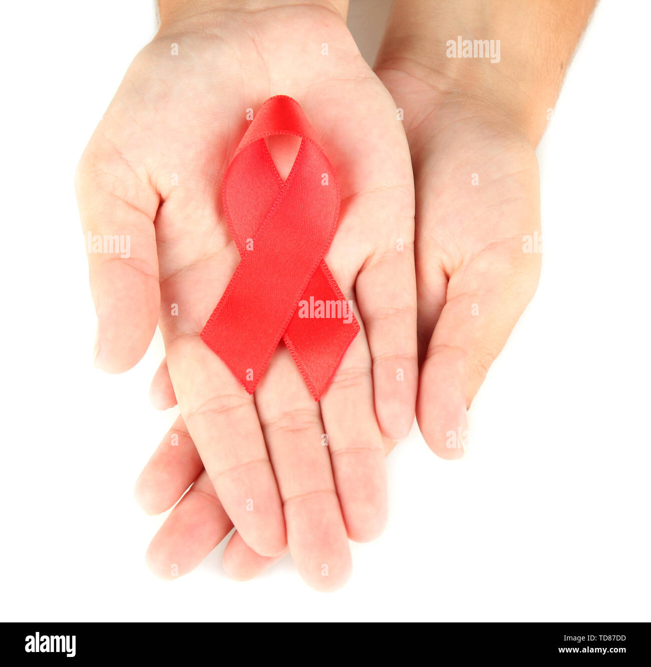 AIDS ribbon in hands isolated on white Stock Photo - Alamy