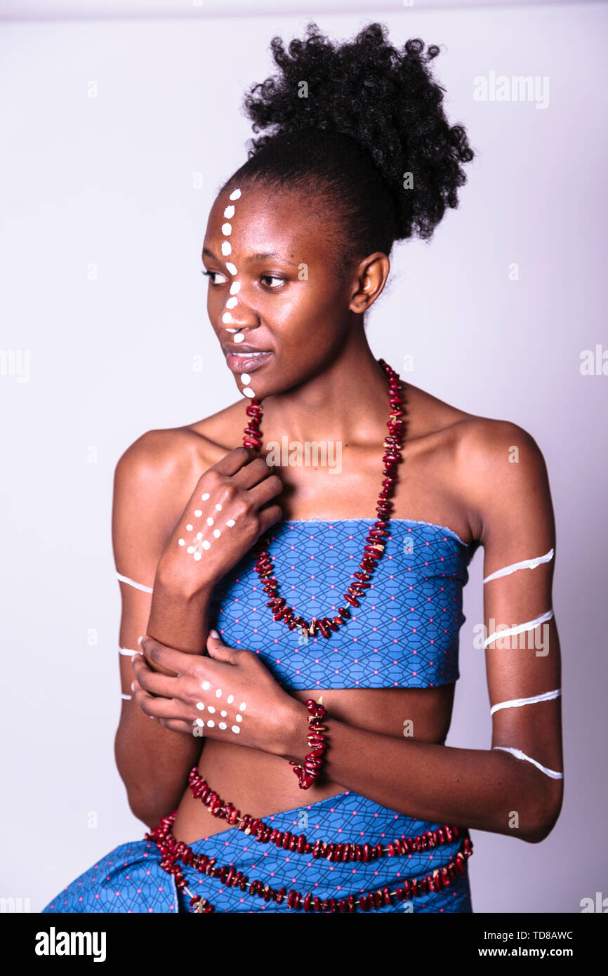 Black woman with face and body art in studio Stock Photo - Alamy