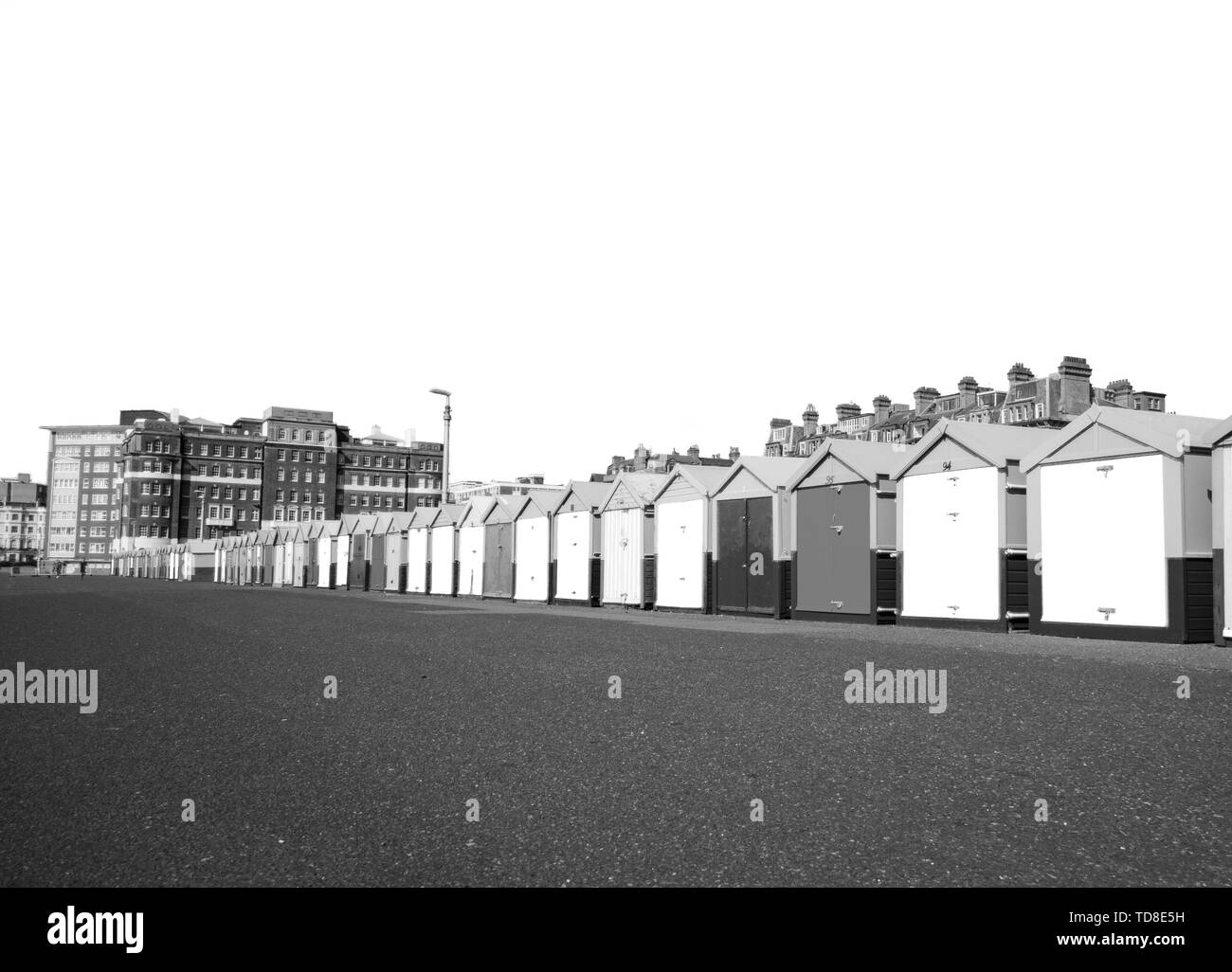 Black-white landscape photography with a row of beach huts of Hove, Brighton, UK. High contrast. Stock Photo