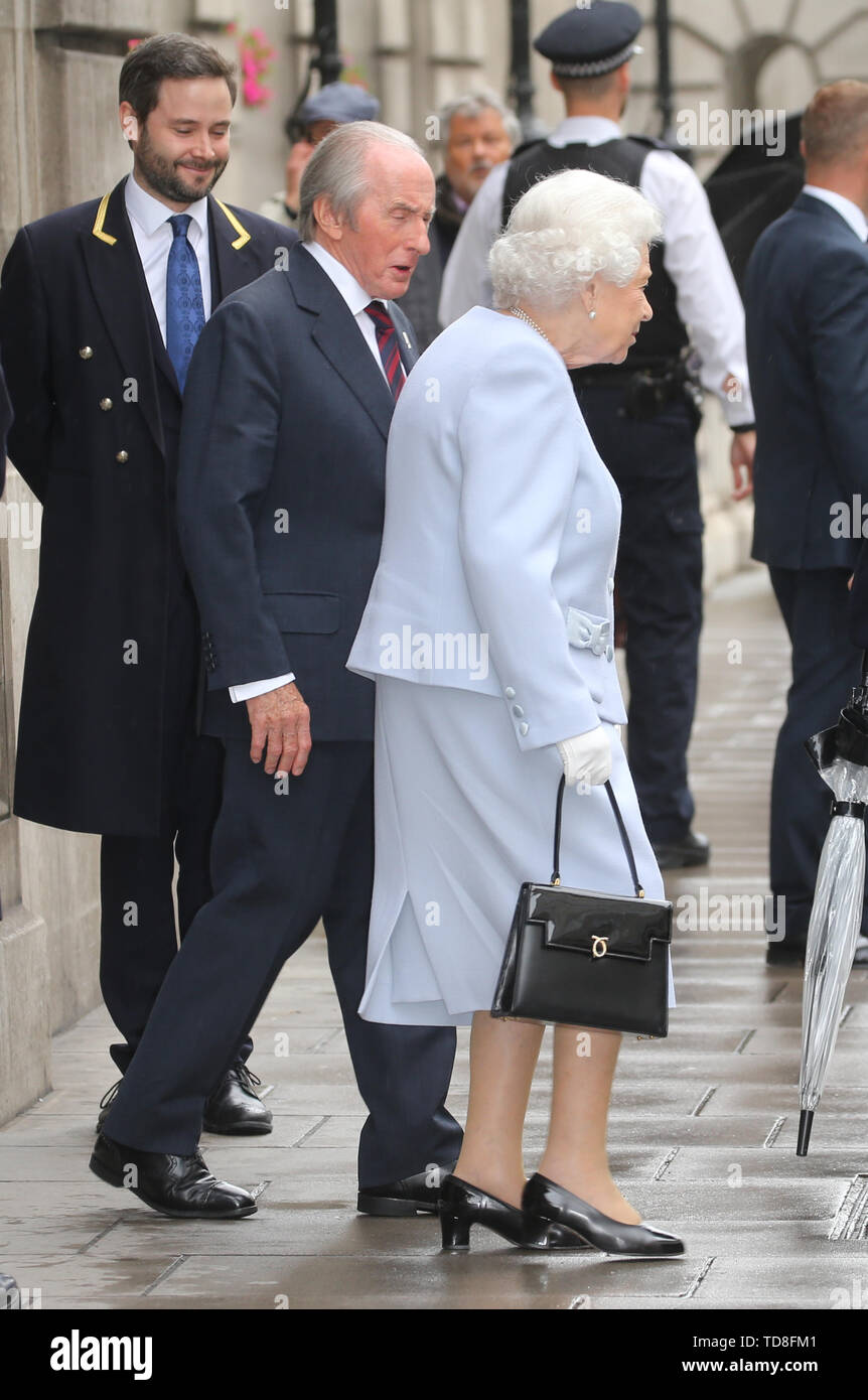 Former motor racing driver Sir Jackie Stewart escorts Queen Elizabeth(02)