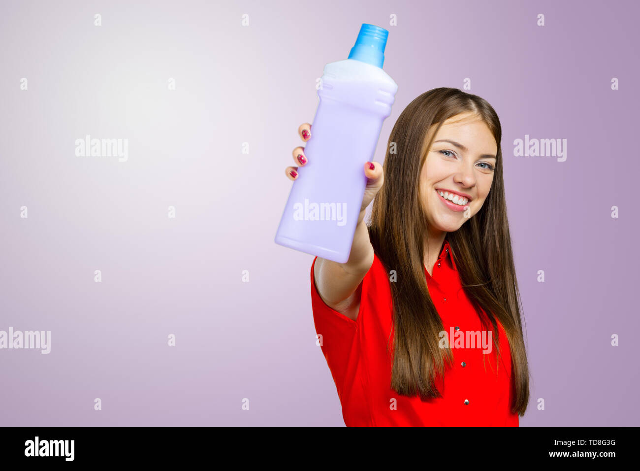 Portrait of a woman with cleaning liquid Stock Photo