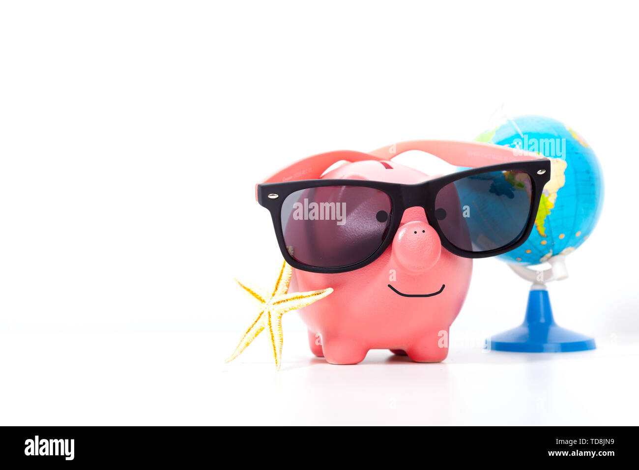 Pink piggy bank with glasses isolated on a white Stock Photo - Alamy