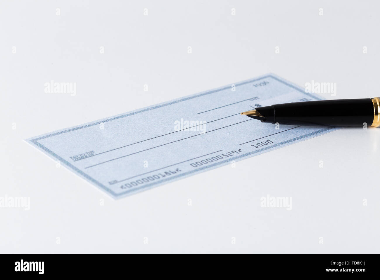 cheque with pen Stock Photo Alamy