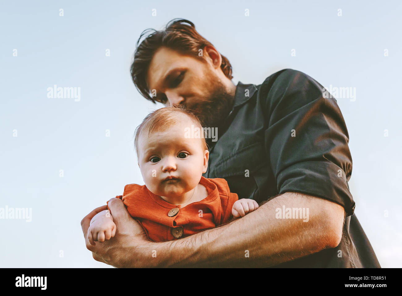 Father holding infant baby Fathers day holiday happy family lifestyle dad and child walking together parenthood childhood concept Stock Photo