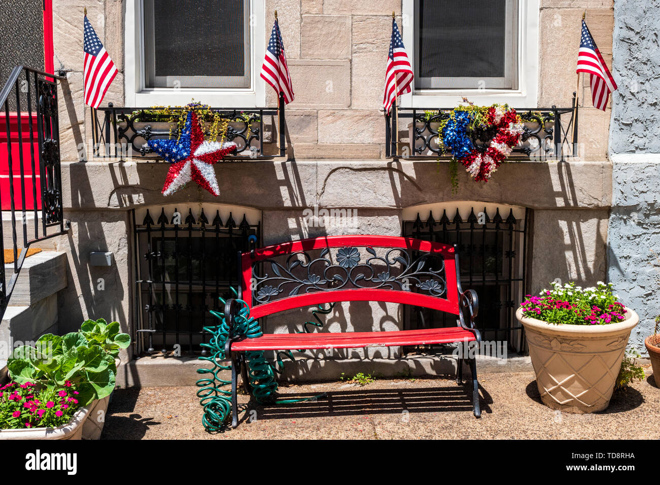 Garden bench with Americana Memorial Day flags & decorations; Philadelphia; Pennsylvania; USA Stock Photo