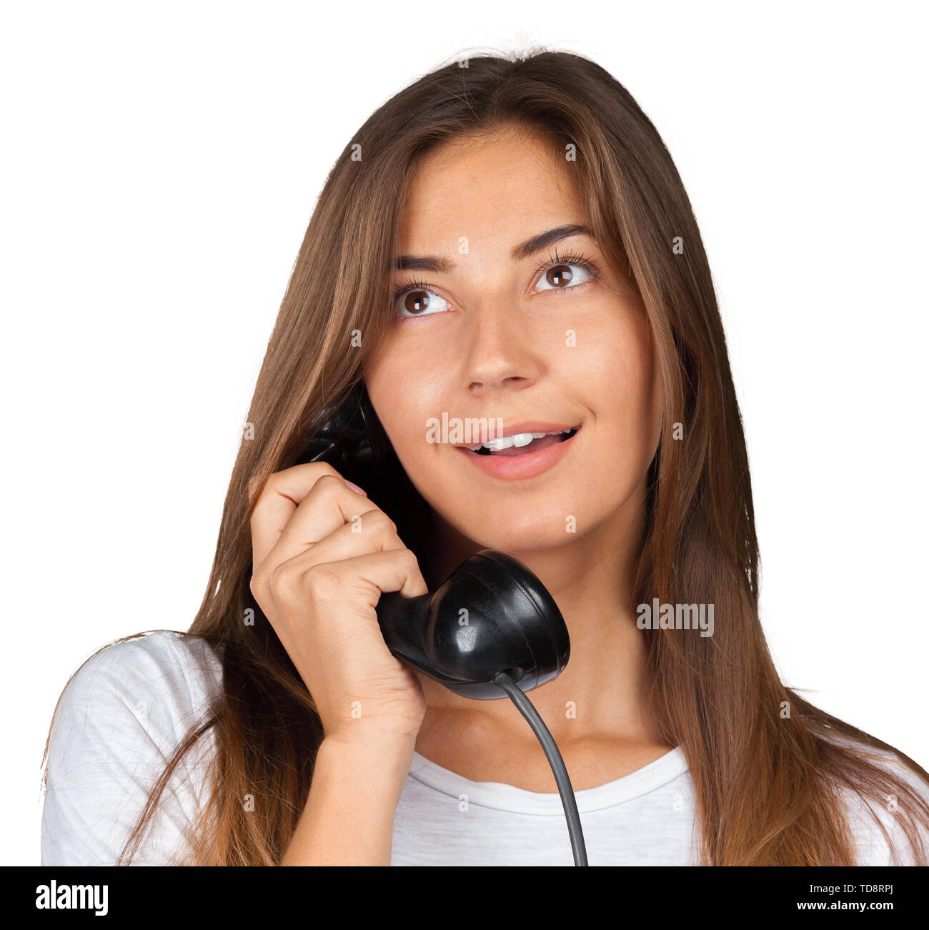 Brunette businesswoman in white shirt holding telephone Stock Photo