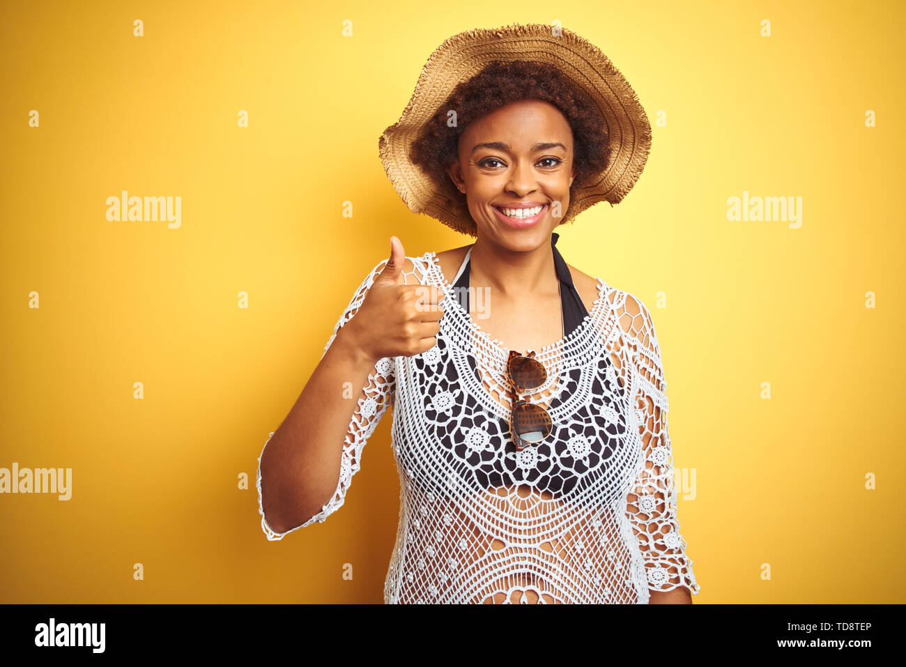 Young African American Woman With Afro Hair Wearing Summer Hat