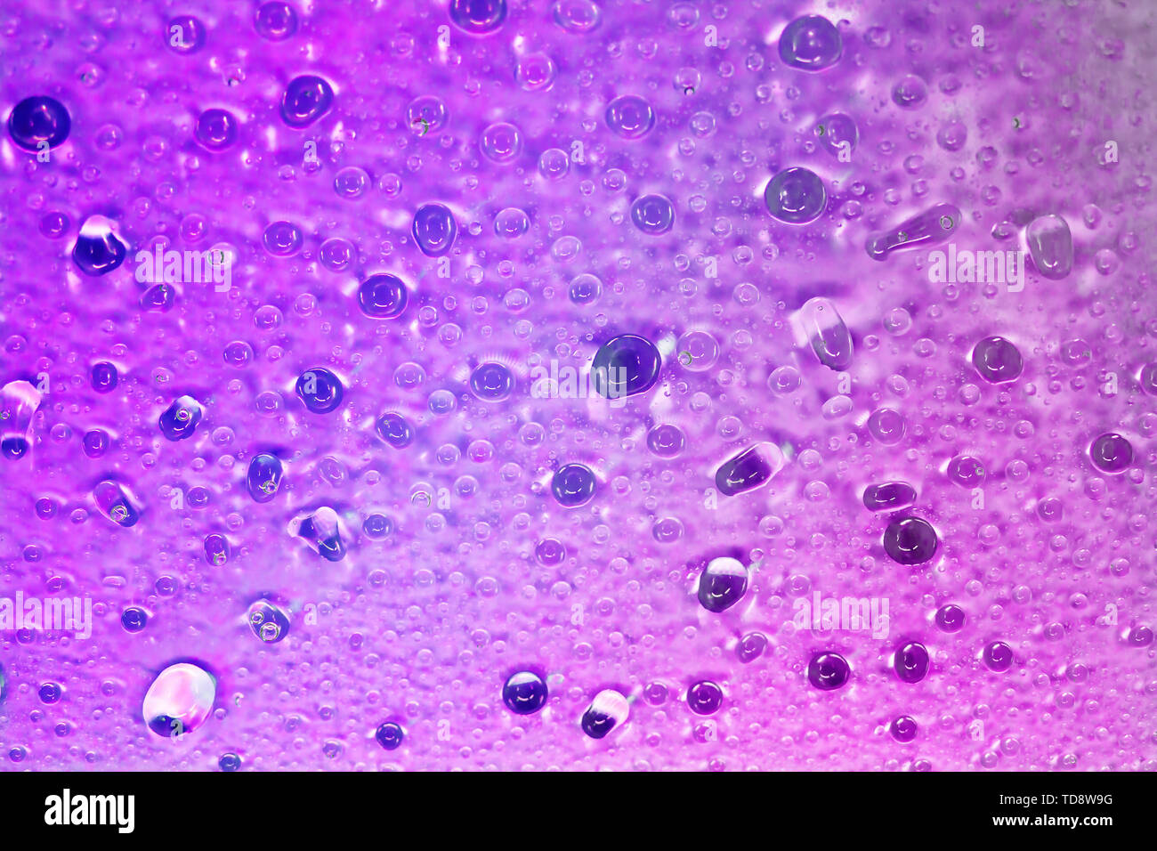 Beautiful violet drops of water fit for the background image Stock Photo