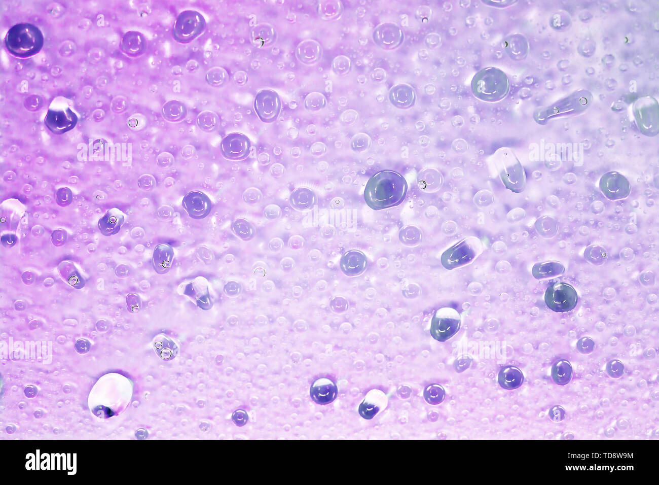 Beautiful violet drops of water fit for the background image Stock Photo