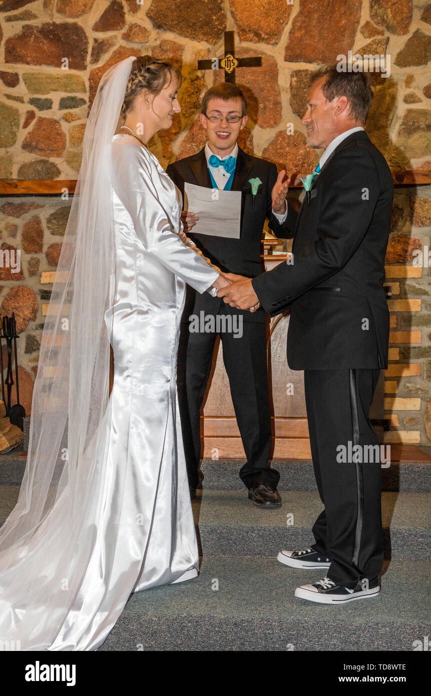 Preacher; bride; groom; wedding ceremony; Congressional Church; Buena Vista; Colorado; USA Stock Photo