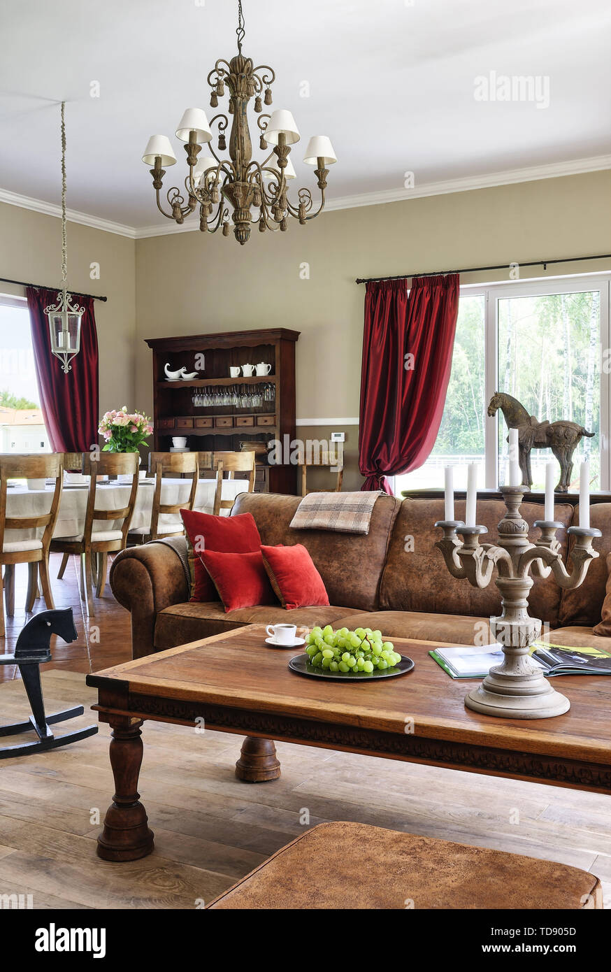 Coffee table in front of leather club sofa in traditional style sitting room    UK AND IRISH RIGHTS ONLY Stock Photo