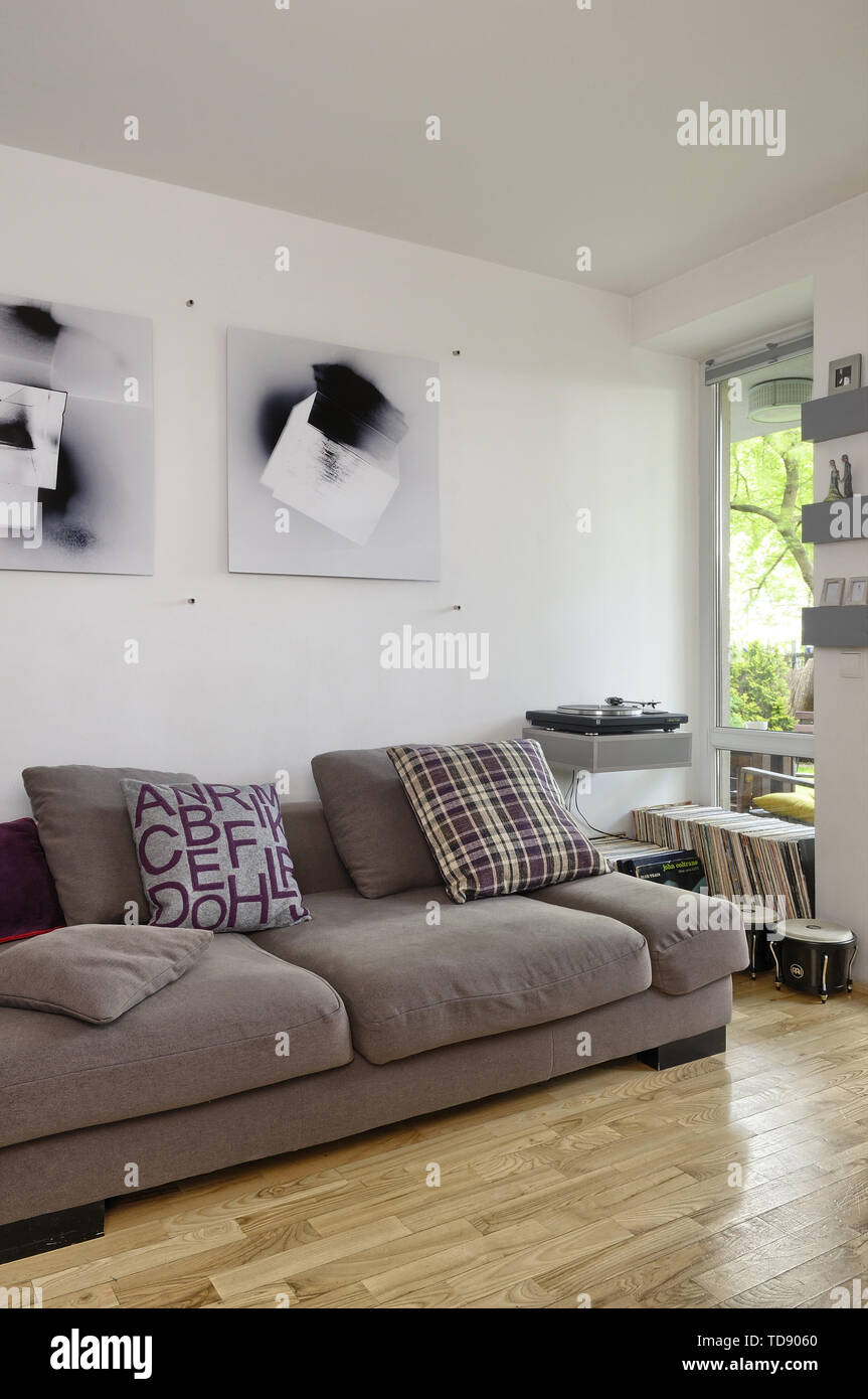 Record Player And Records Collection Next To Sofa With