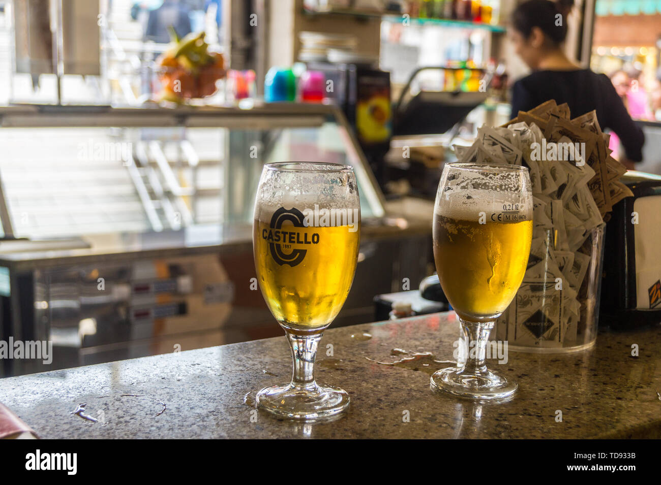 PHOTOGRAPH Two glasses of Castello beer  on a bar, Ponte delle Guglie, Venice, Veneto, Italy Stock Photo