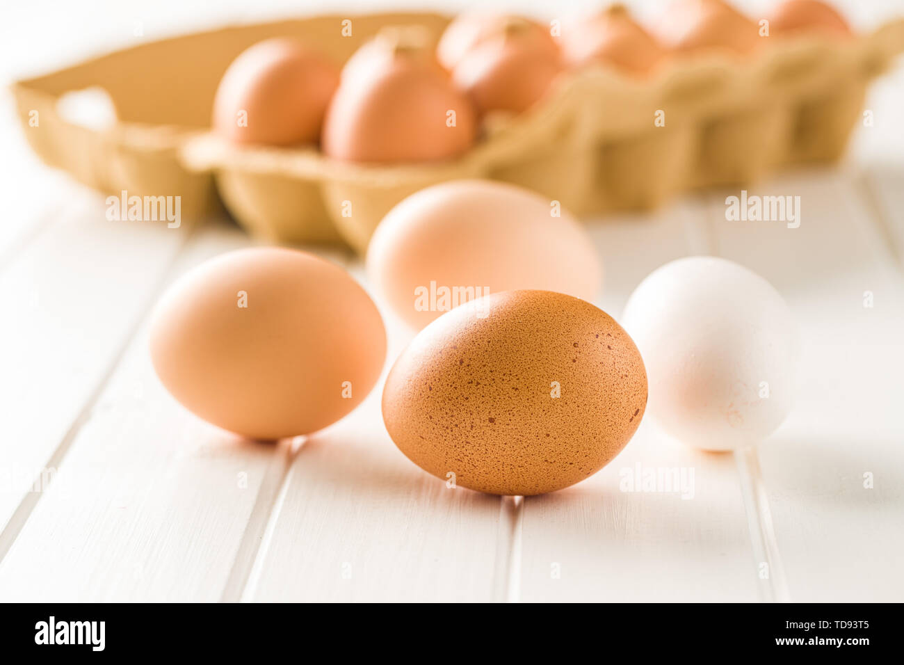 Raw chicken eggs on white table. Stock Photo
