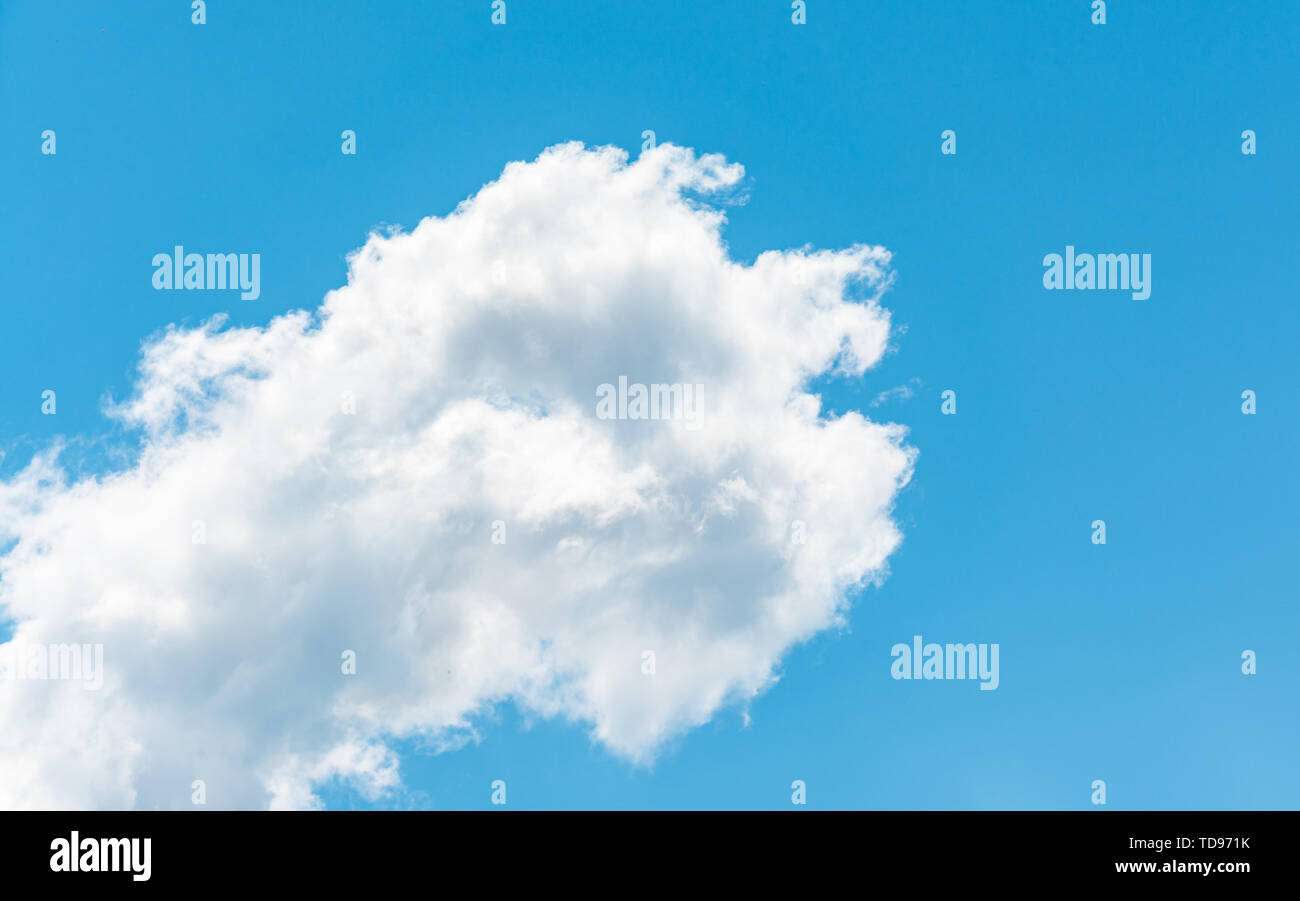 Cloudscape with fluffy clouds in a sunny day of spring Stock Photo