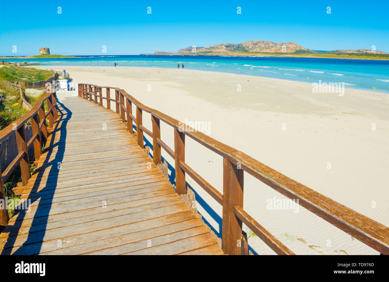 landscape of empty La Pelosa beach in a sunny day, with its white sand and clear water Stock Photo
