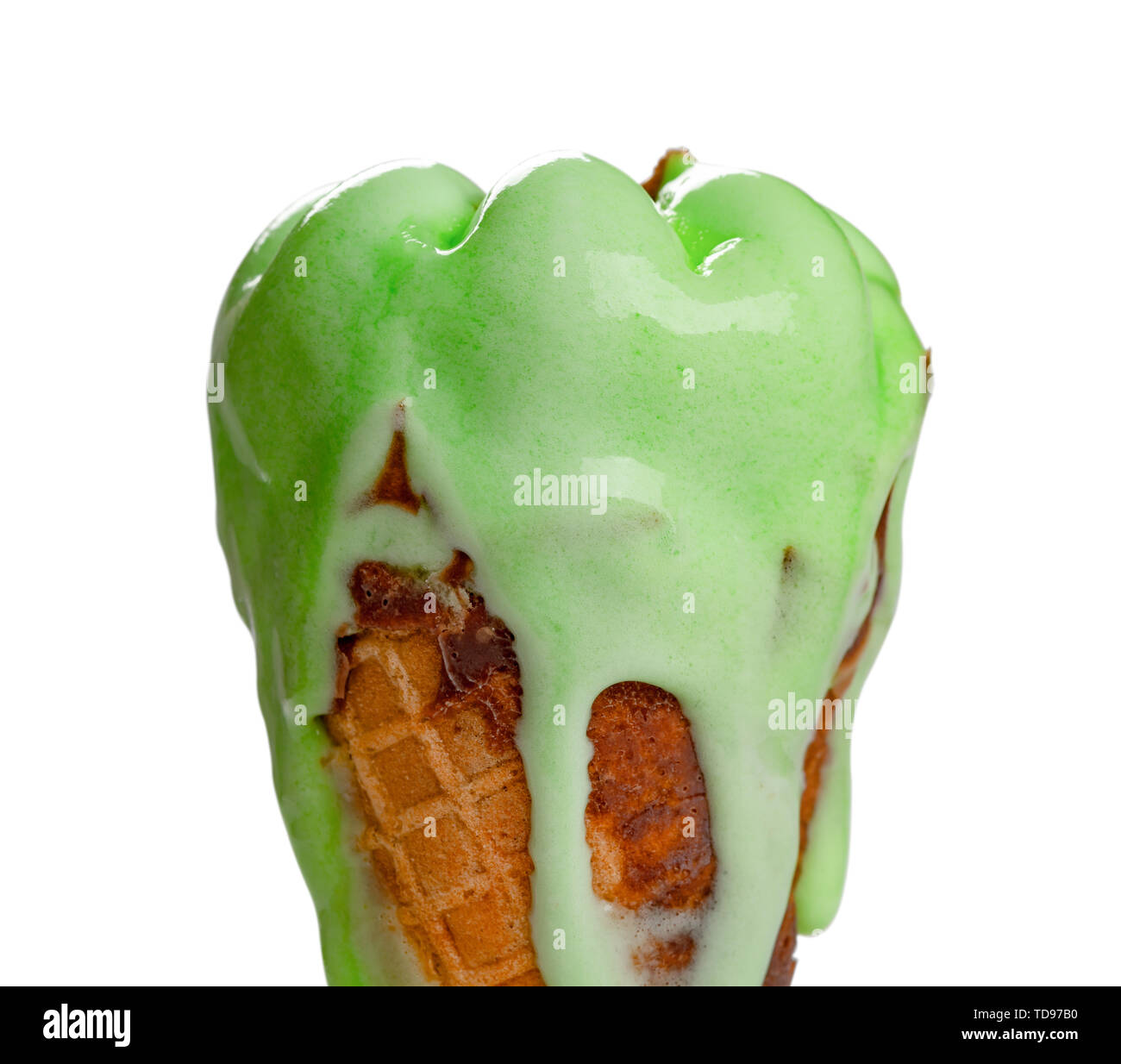 side view green ice cream cone melting on a white background Stock