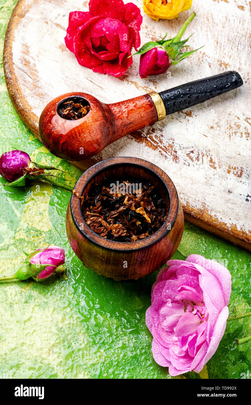 Tobacco pipe and smoking tobacco with rose flavor.Refined taste of