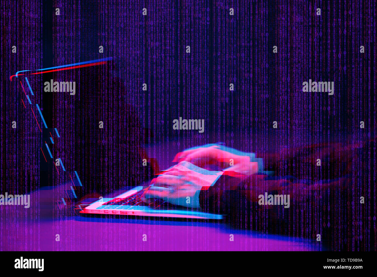 Hacker working with laptop in dark room with digital interface around. Image with glitch effect. Stock Photo