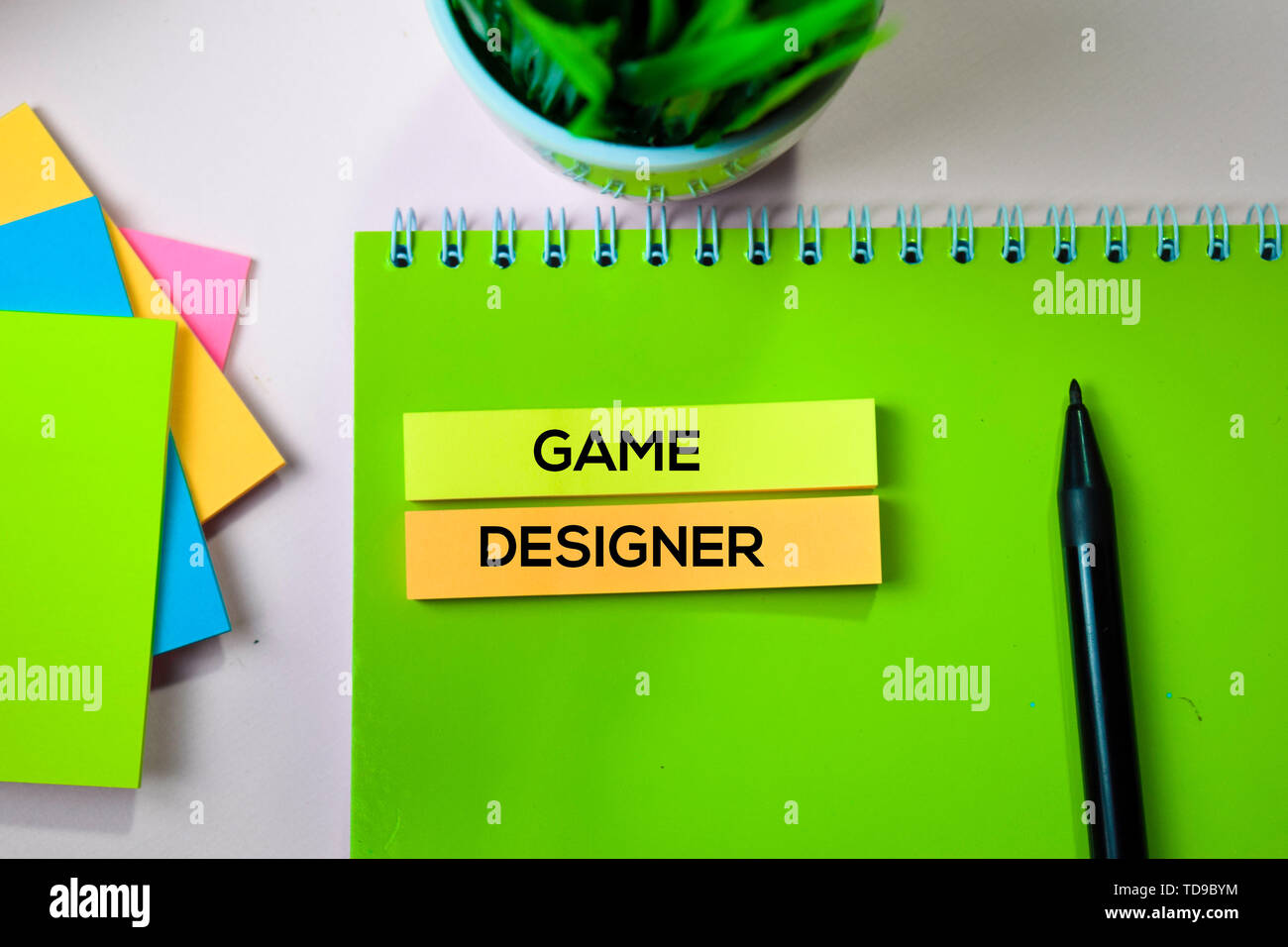 Game Designer text on sticky notes with office desk concept Stock Photo