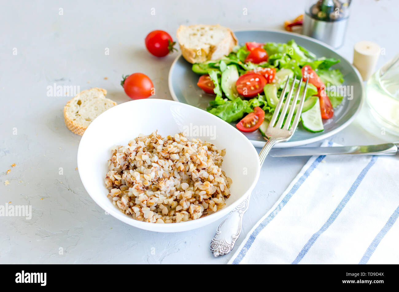 hot Buckwheat porridge with melting butter in white plate and vegetable  salad for lanch on table, top view, copy space Healthy food concept Stock  Photo - Alamy
