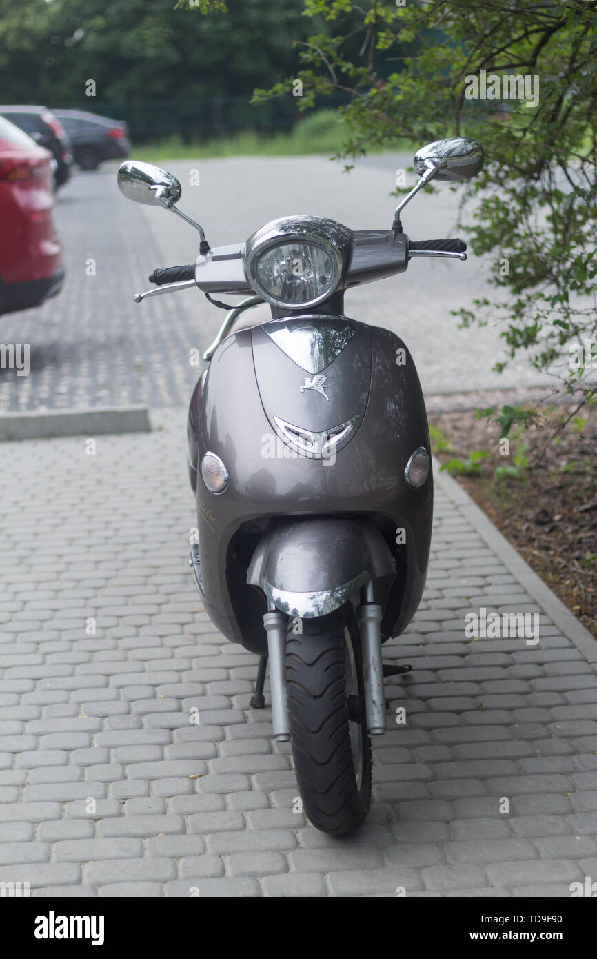Gdansk Oliwa, Poland - June 7, 2019: Gray vintage Romet scooter standing on  the pavement on a cloudy day with parking lot and trees in the background  Stock Photo - Alamy