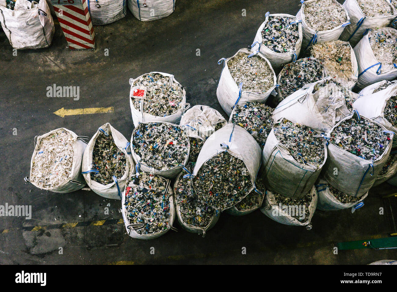 Bags with recycled plastic at a waste sorting plant. Separate garbage collection and sorting. Recycling and recycling plastics Stock Photo