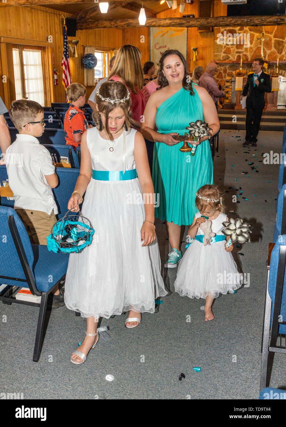 Flower girls walking aisle after wedding ceremony; Congressional Church