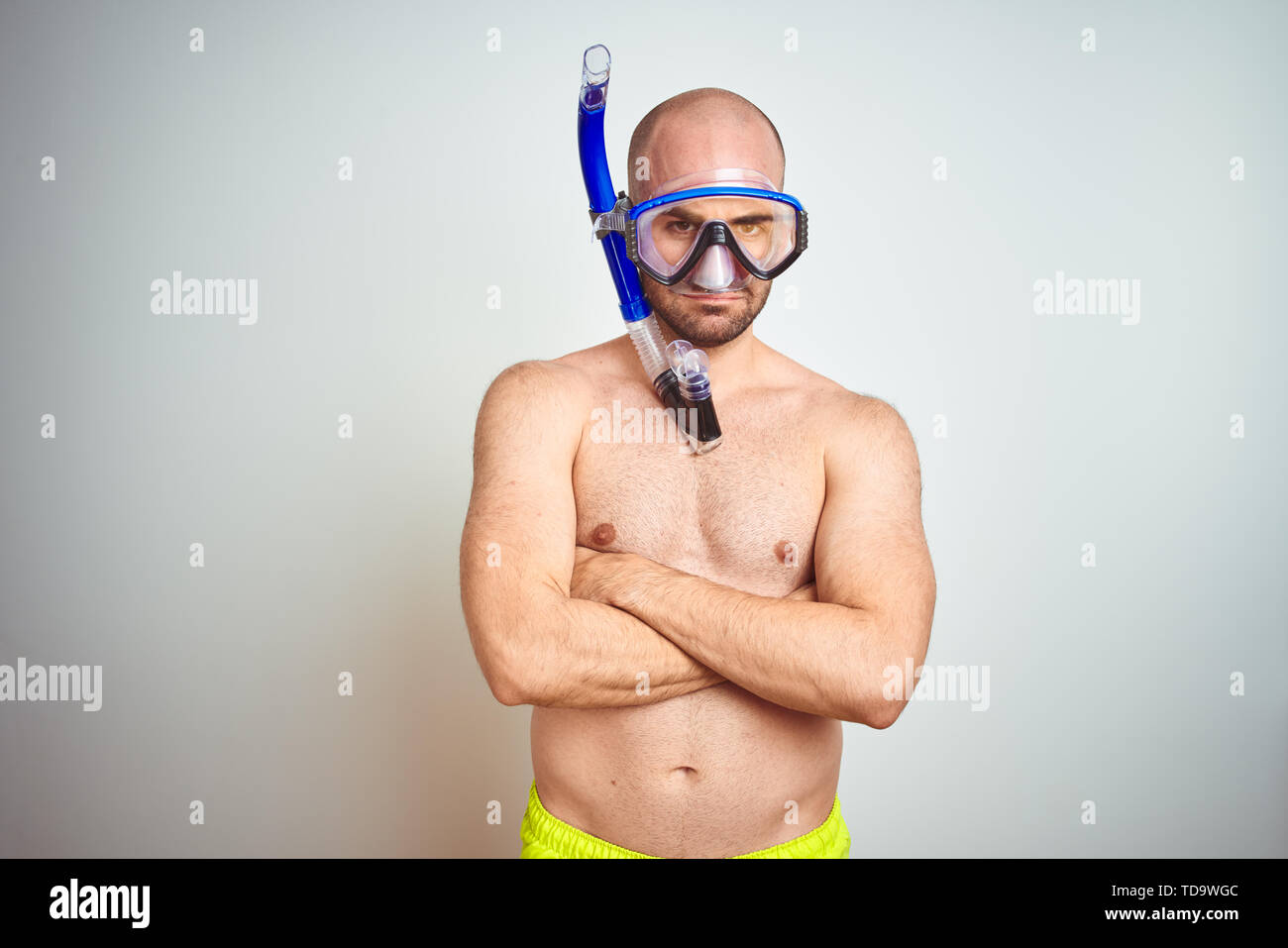 young-man-wearing-diving-snorkel-goggles-equipent-over-isolated-background-skeptic-and-nervous-disapproving-expression-on-face-with-crossed-arms-neg-TD9WGC.jpg